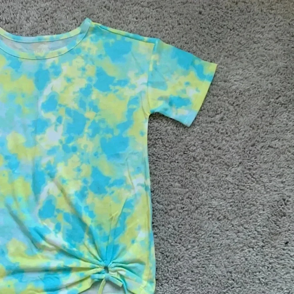 Girls tie dye shirt with cute detail on the bottom right part of the shirt